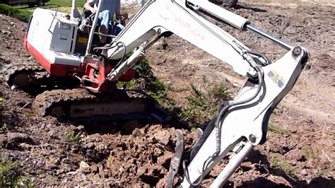 how to drive a mini excavator up a hill|mini ex up a slope.